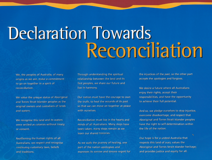 An image of the text of the Australian Declaration Towards Reconciliation. White and yellow text on a dark blue background, with Indigenous artwork overlay, and strips of red and yellow at the top.