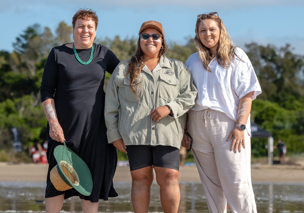 Yeshe Smith (Partnership Brokers Association), Amber Hamer (Naru Goori Groms) and Alanah Scholes (NRL) on the beach at Coffs Harbour. Photo: Lee Davison