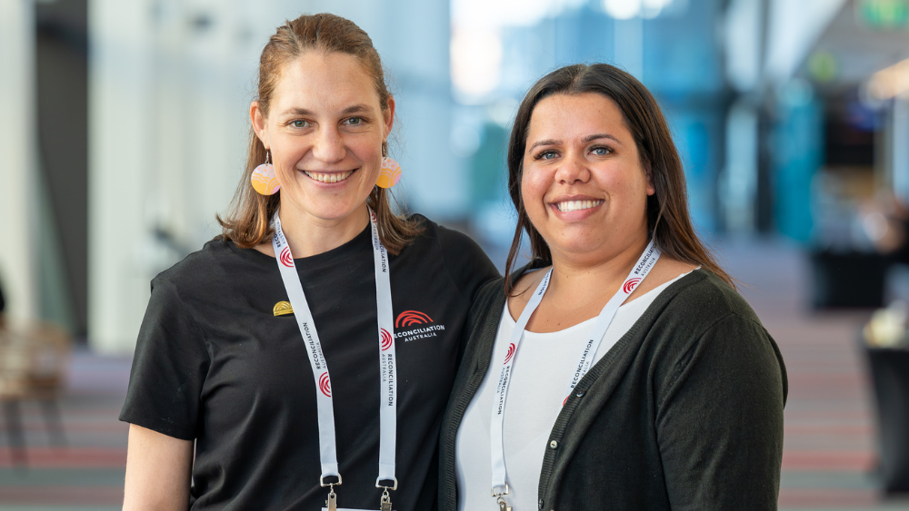 Reconciliation Australia staff members standing together, smiling